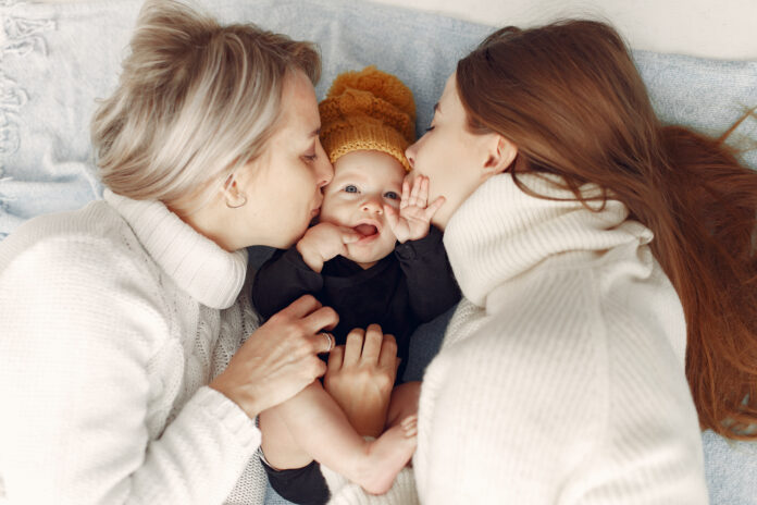 Elegant grandma at home with daughter and grandson